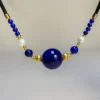 16mm imperial lapis lazuli cord necklace with pearls in a centered front view
