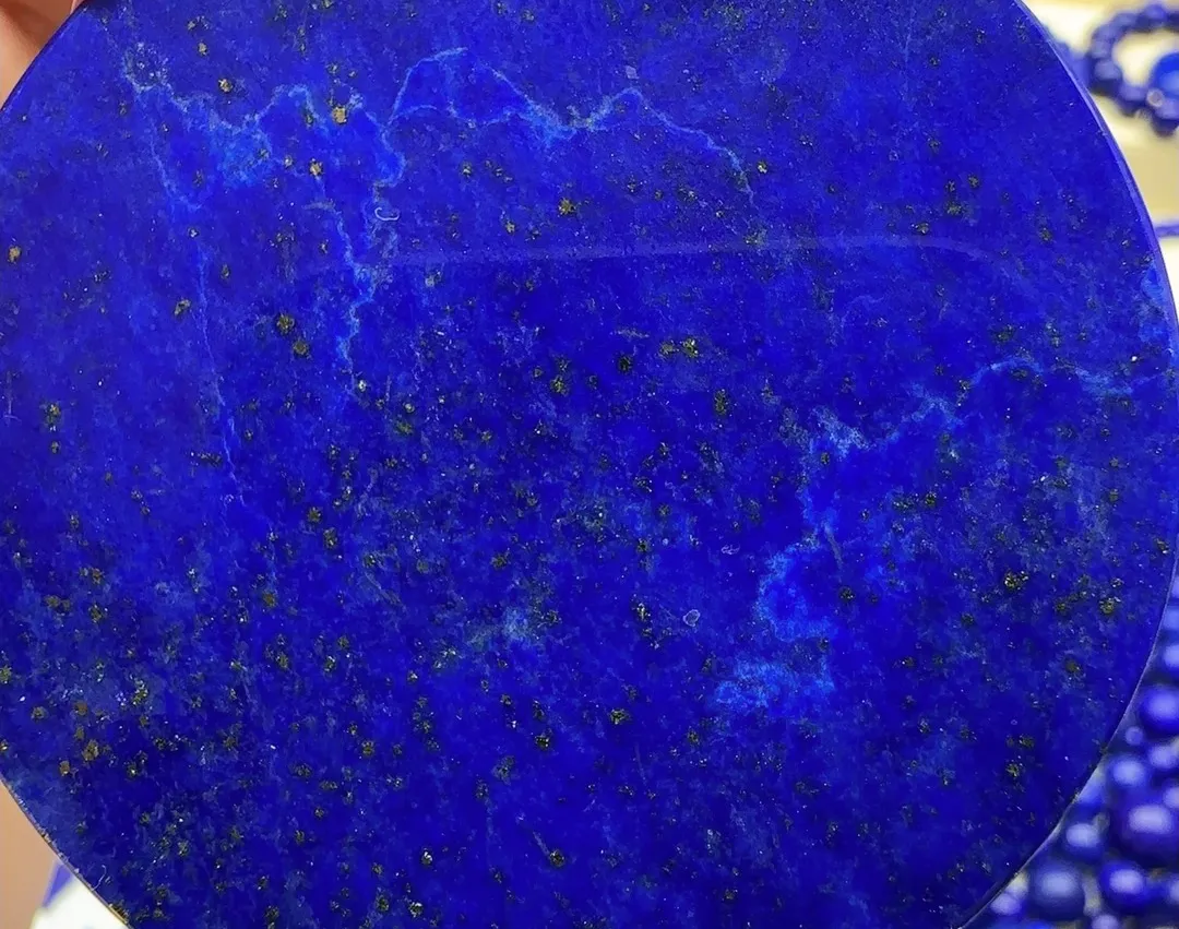 Deep blue lapis lazuli with visible gold-colored pyrite-like mineral flecks