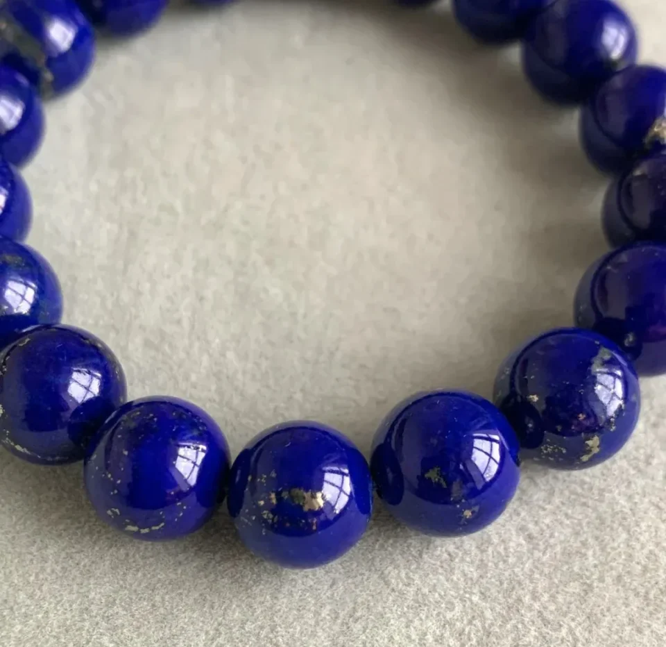 Close-up of deep blue lapis lazuli with natural gold-colored metallic flecks
