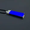 Diagonal profile of blue lapis pendant with silver Greek Key motif