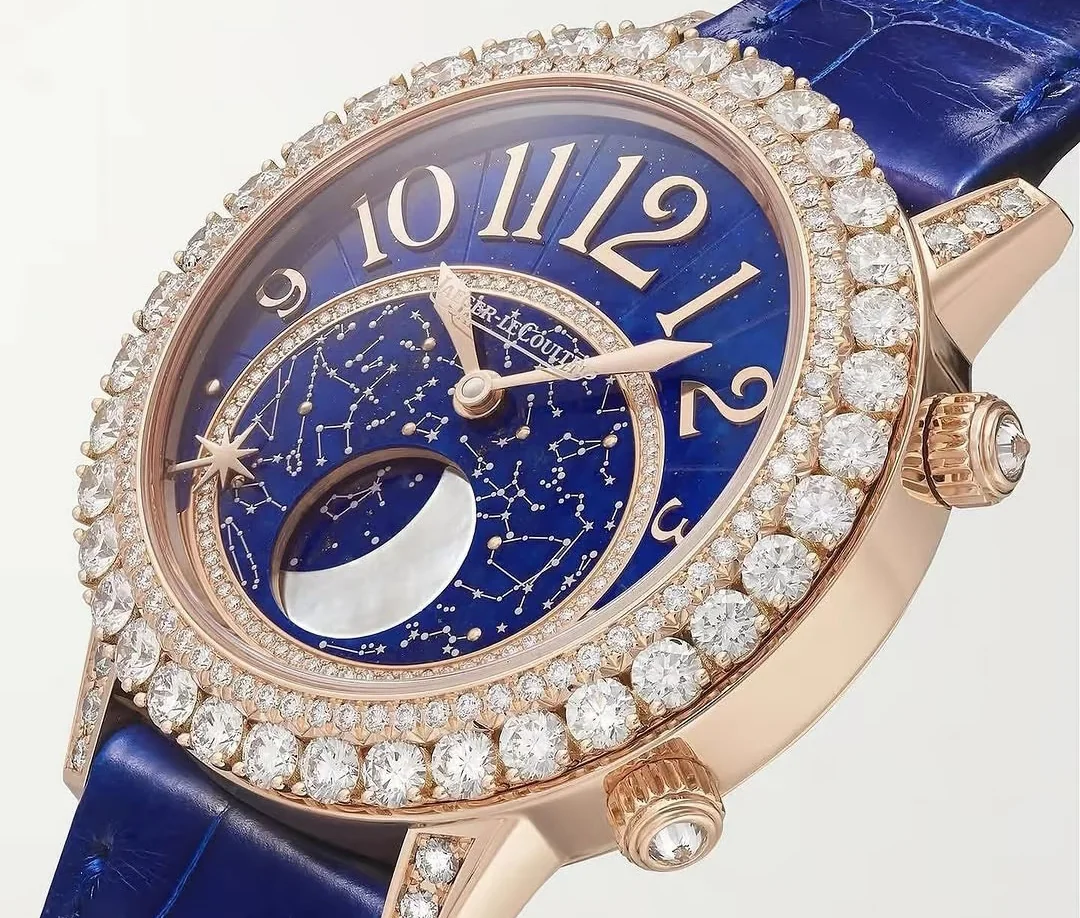 Luxury watch with a vivid blue stone dial beside a blue gemstone setting