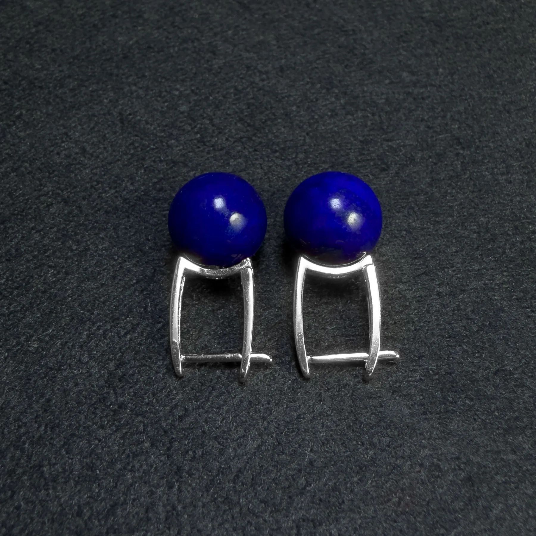 Back view of deep-blue lapis bead earrings with hinged silver clasps