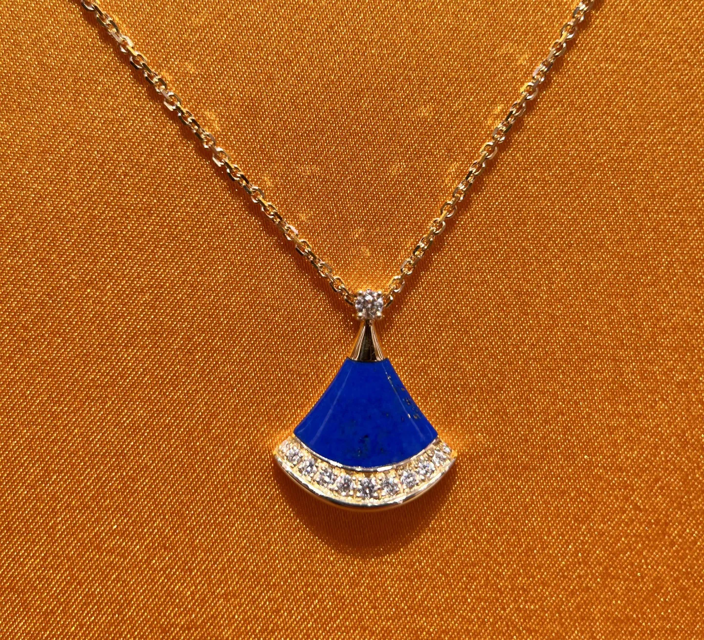 Fan-shaped lapis lazuli pendant with gold-tone details