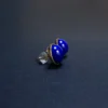 Side profile of gold-tone bezel lapis studs with posts and backs