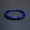 Front view of a lapis stretch bracelet with gold-plated S925 round spacers