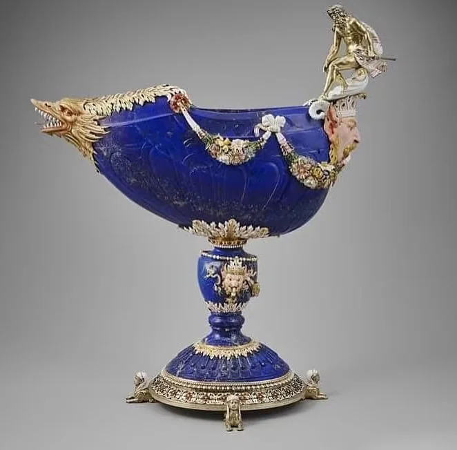 Ornate blue stone vessel with detailed gold decoration