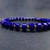 Front macro of royal-blue straight-cut lapis beads and small gold-plated silver spacers