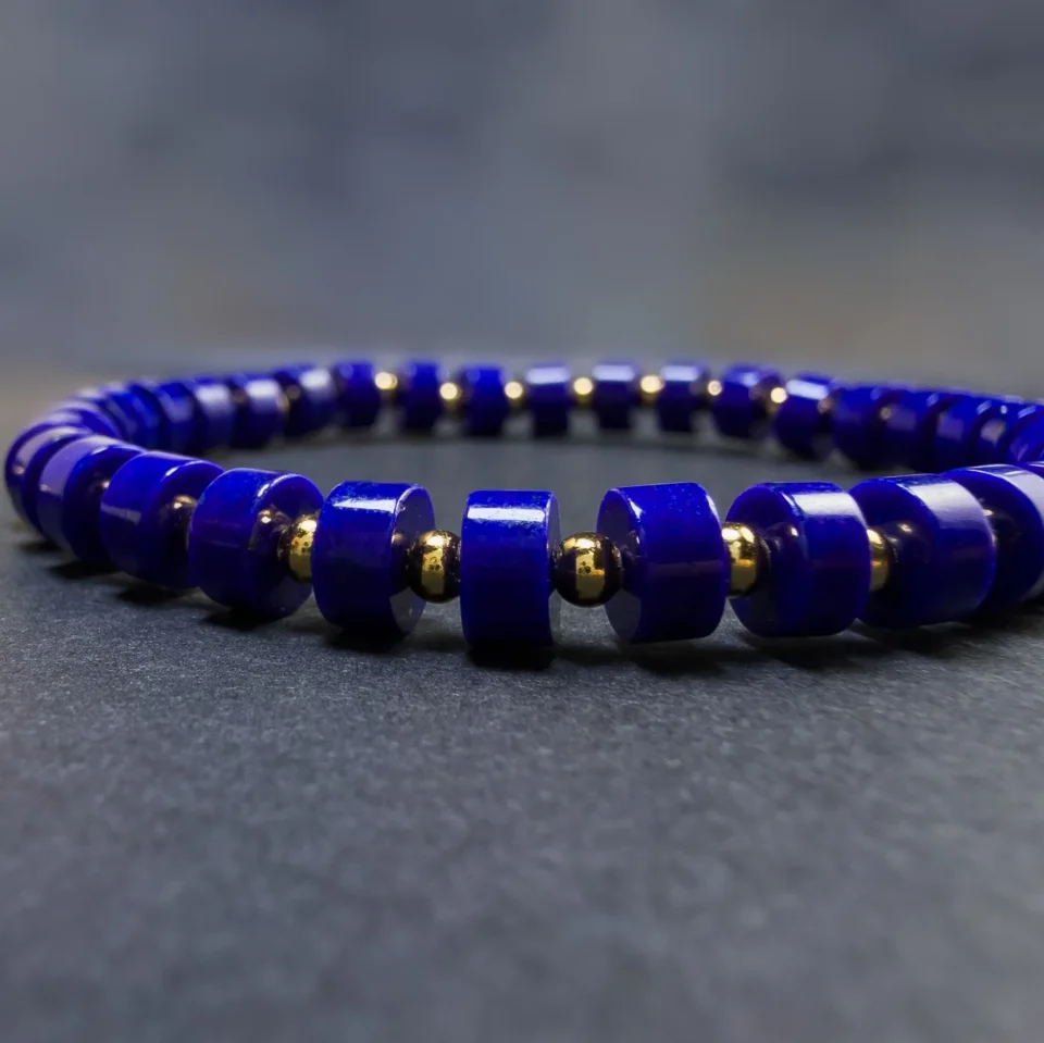 Front macro of royal-blue straight-cut lapis beads and small gold-plated silver spacers