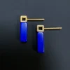 Rear view of blue lapis bar earrings with square gold studs and posts