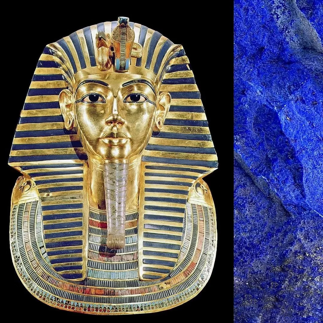 Ancient Egyptian gold mask beside a polished blue lapis lazuli piece