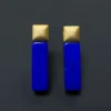 Front view of cobalt blue lapis lazuli bar earrings with matte gold square tops