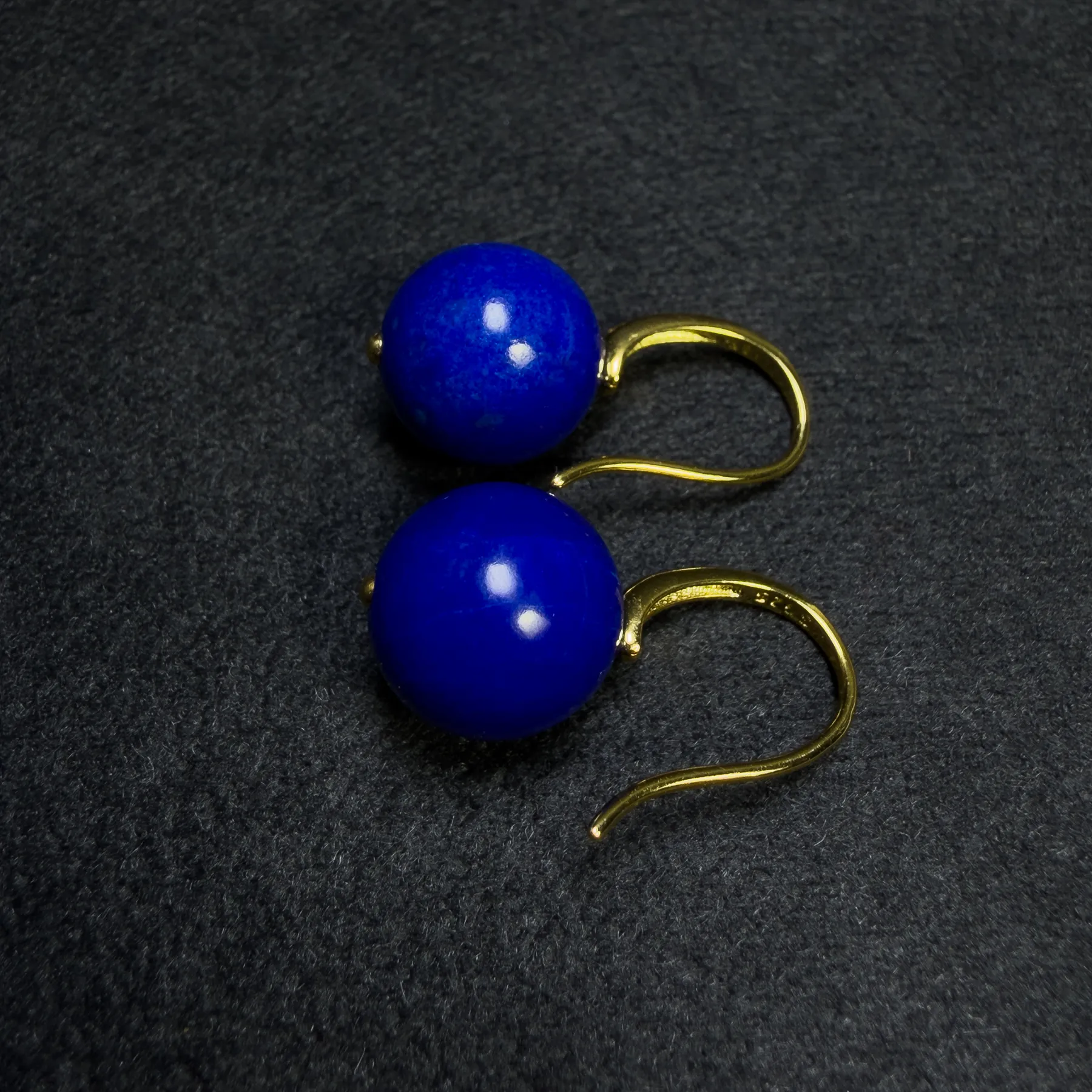 Angled round lapis lazuli bead earrings with polished gold-plated silver hooks