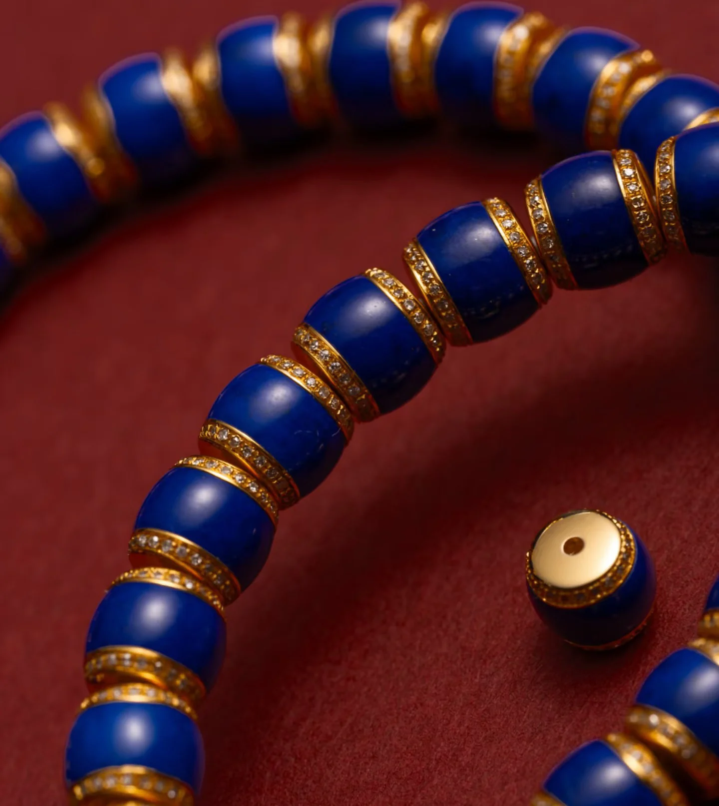 Close-up of blue lapis lazuli bracelet beads with varied color and pattern