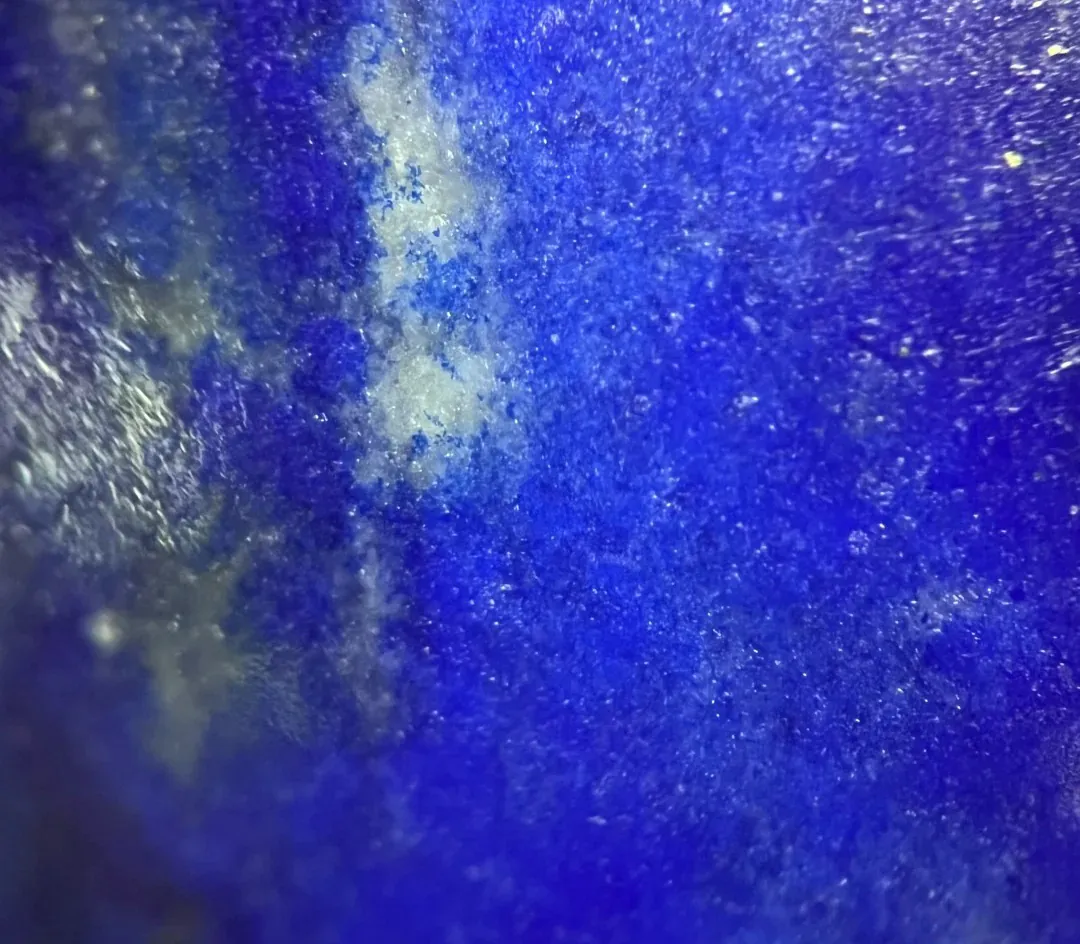 Macro view of blue lapis lazuli with a lighter natural mineral area