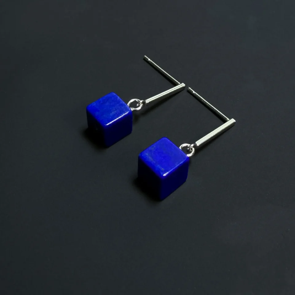 Pair of blue lapis lazuli cube earrings with polished silver bar studs