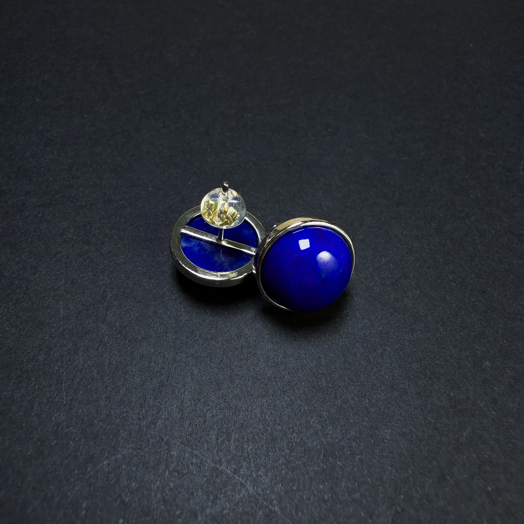 Rear and front view of lapis stud earrings with silver framework and post back