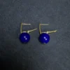 Open leverback clasp detail on gold-tone lapis lazuli earrings