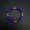 Lapis lazuli bracelet with four Nanhong agate beads in a full circle