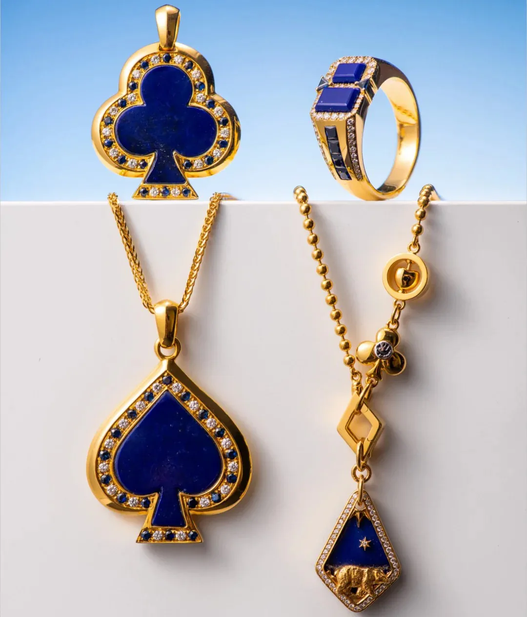 Lapis lazuli earrings with polished blue inlays and gold-tone settings