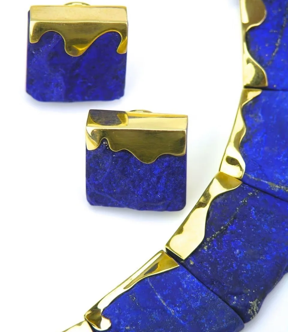 Lapis lazuli necklace and earrings with deep blue and gold-tone details