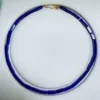 Lapis lazuli rectangular bead necklace arranged on a white jewelry display