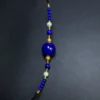 Vertical view of lapis lazuli sliding cord necklace with symmetric pearl accents