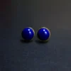 Matched deep-blue lapis lazuli bezel earrings standing side by side