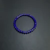 Wide product view of a minimalist straight-cut lapis lazuli stretch bracelet