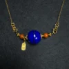 Natural lapis lazuli orbit pendant with red Nanhong agate and blessing charm