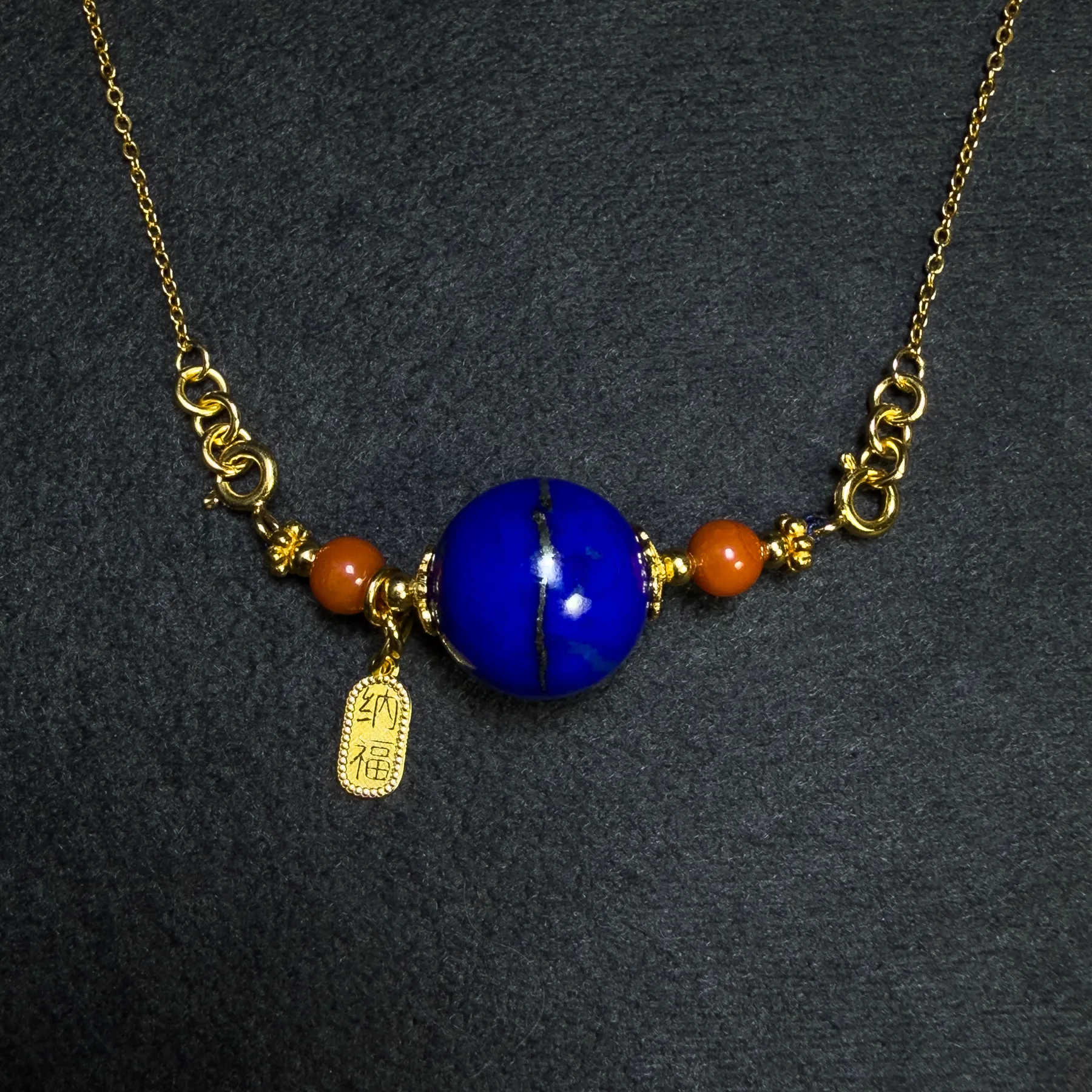 Natural lapis lazuli orbit pendant with red Nanhong agate and blessing charm
