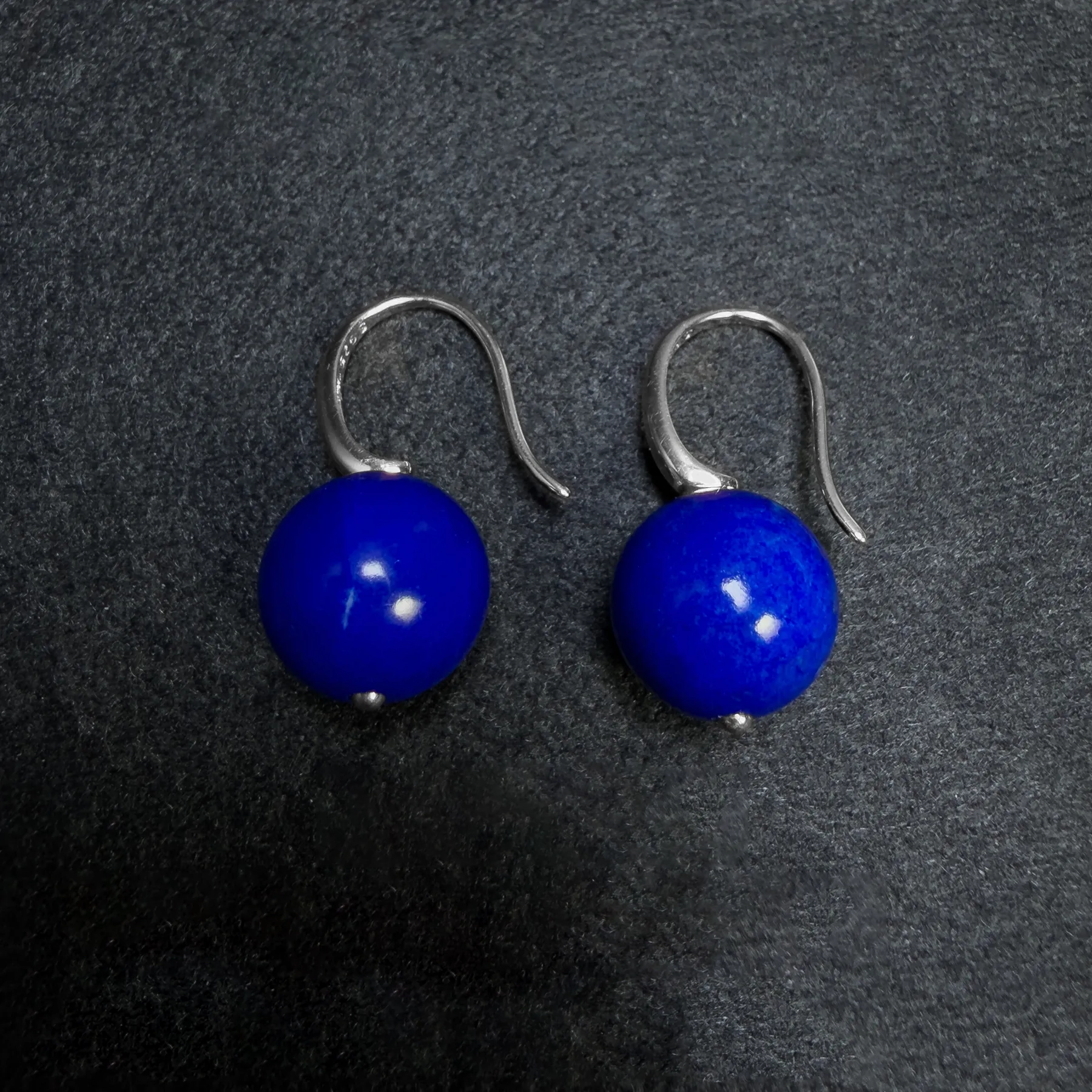 Close natural lapis lazuli earrings with curved S925 silver ear wires