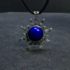 Natural lapis lazuli sun pendant in antiqued sterling silver, front view