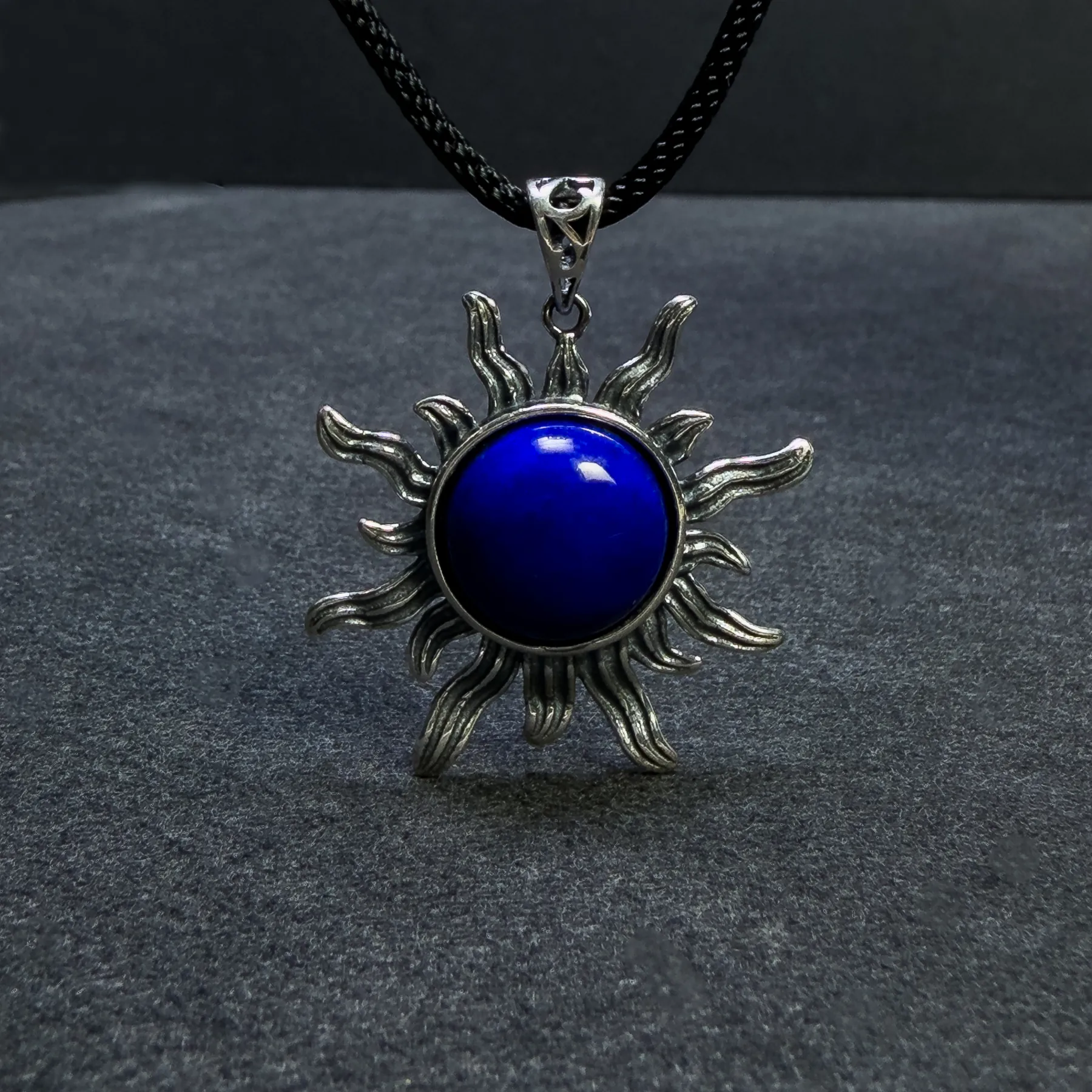 Natural lapis lazuli sun pendant in antiqued sterling silver, front view
