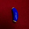 Polished curved lapis lazuli component with gold-plated cubic zirconia spacer details