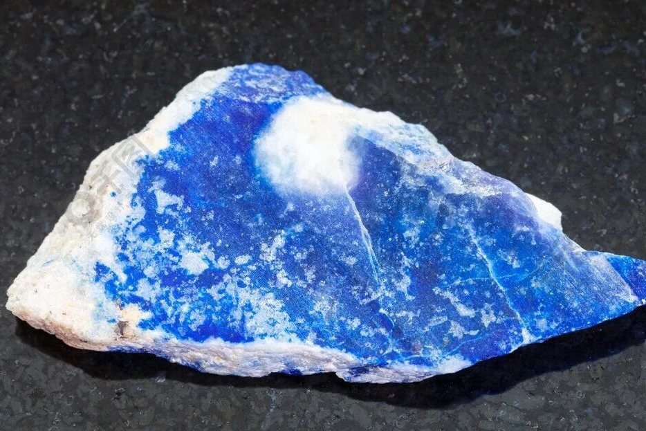 Rough blue lapis rock with broad white calcite areas