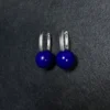 Upright silver leverback earrings with paired round lapis lazuli beads