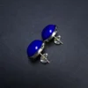 Side detail of lapis lazuli cabochon studs with silver posts and clear backs