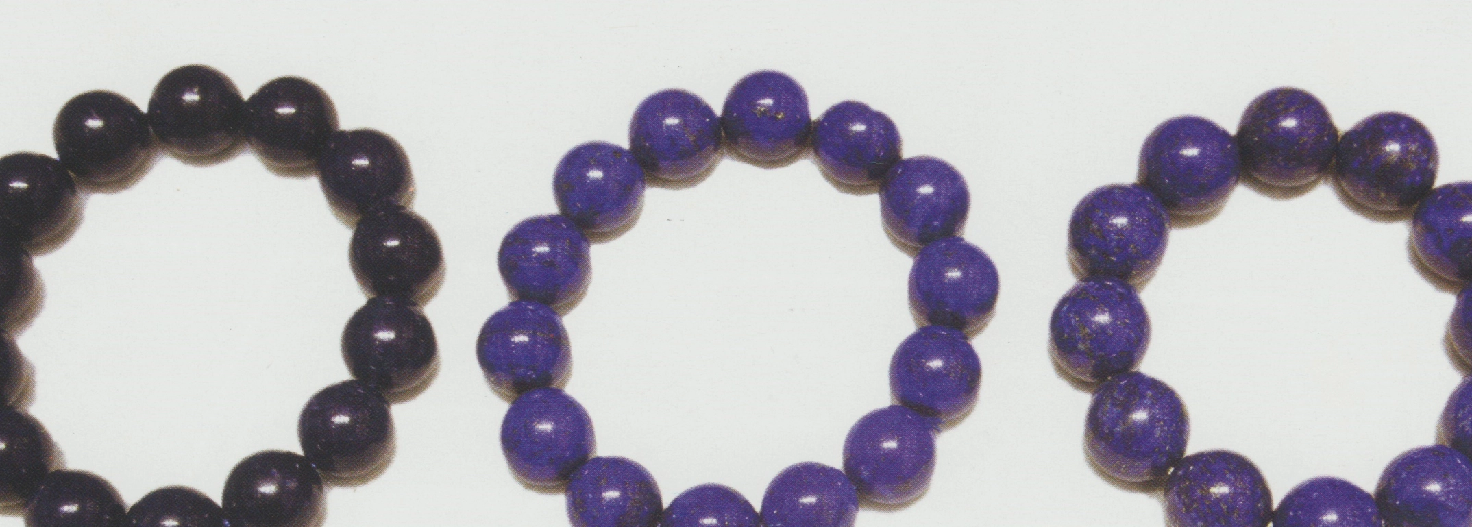 Three blue bead bracelets showing different colour depth and patterning