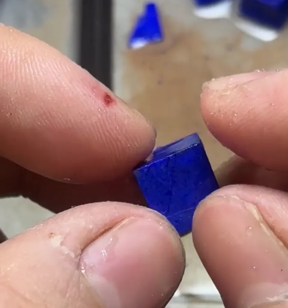 Cut lapis lazuli bead blank at the start of the rounding stage
