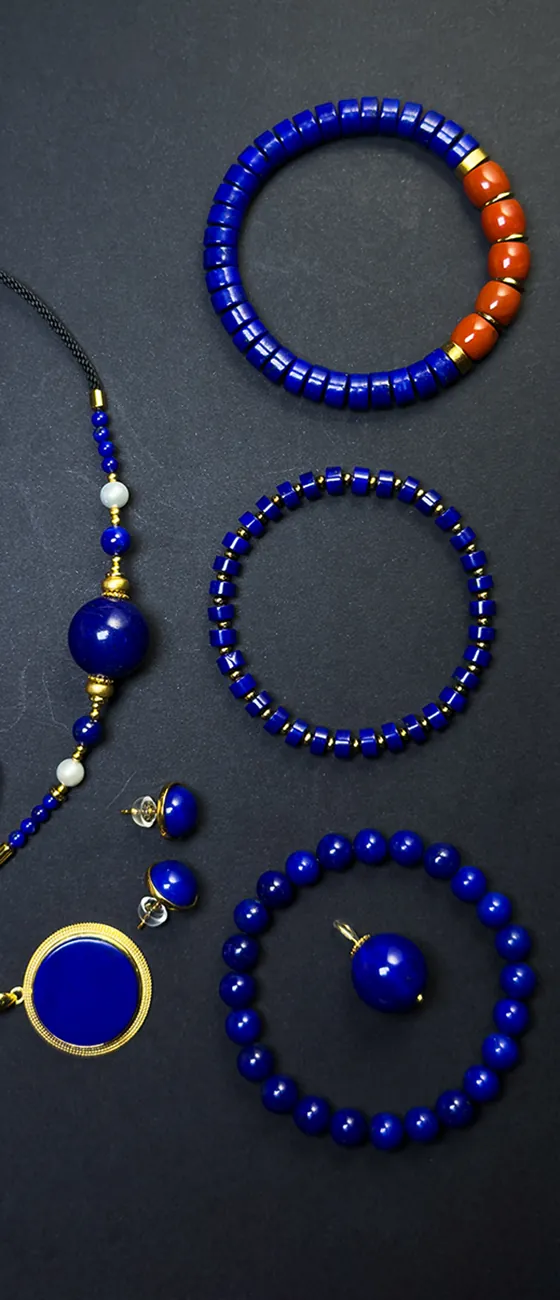 Assorted lapis lazuli jewelry with bracelets earrings and pendant