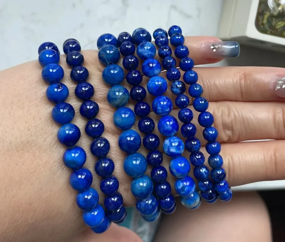 Natural lapis lazuli samples ranging from grayish blue to saturated royal blue
