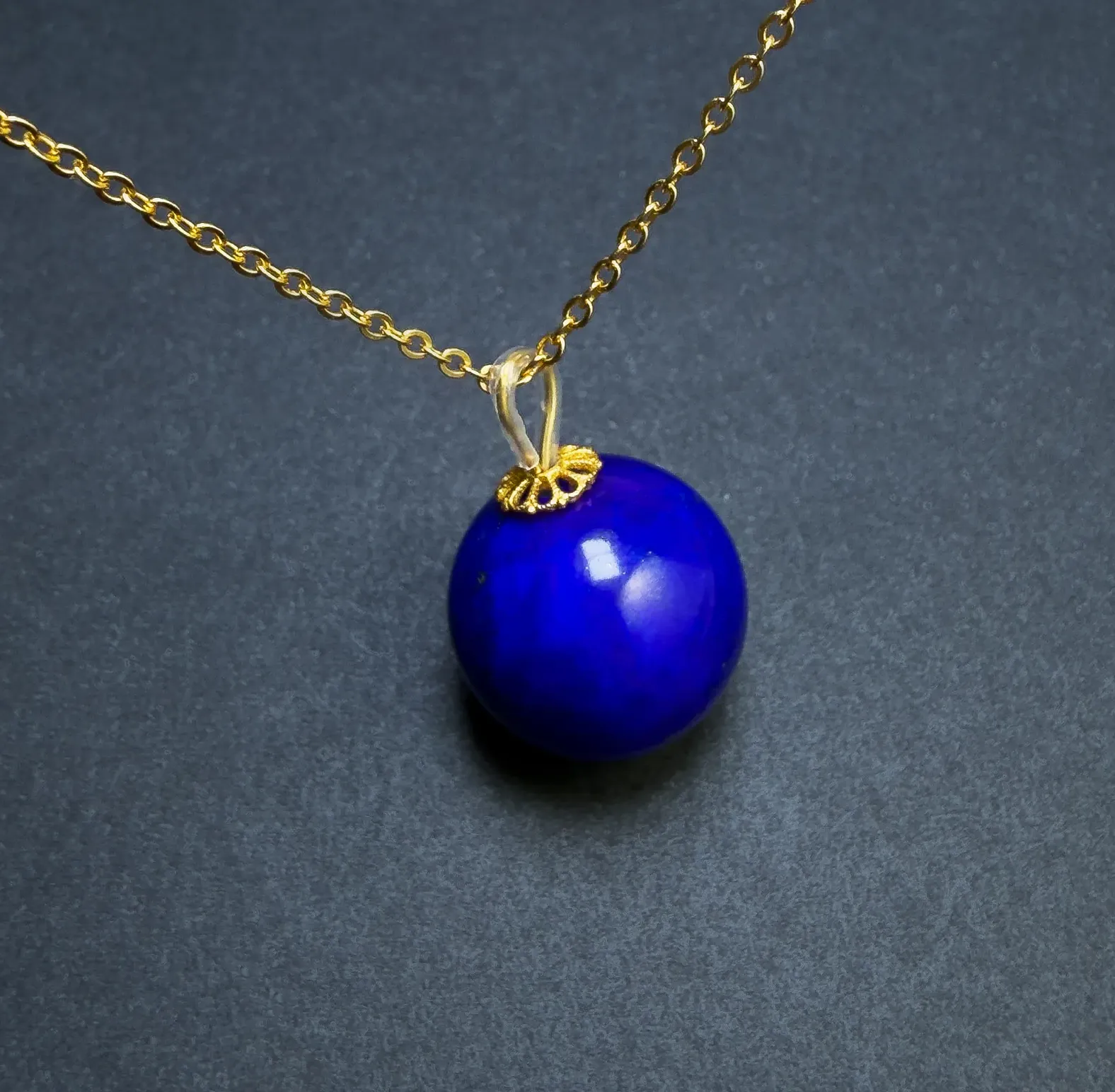 Royal-blue lapis lazuli paired with warm gold-tone metal