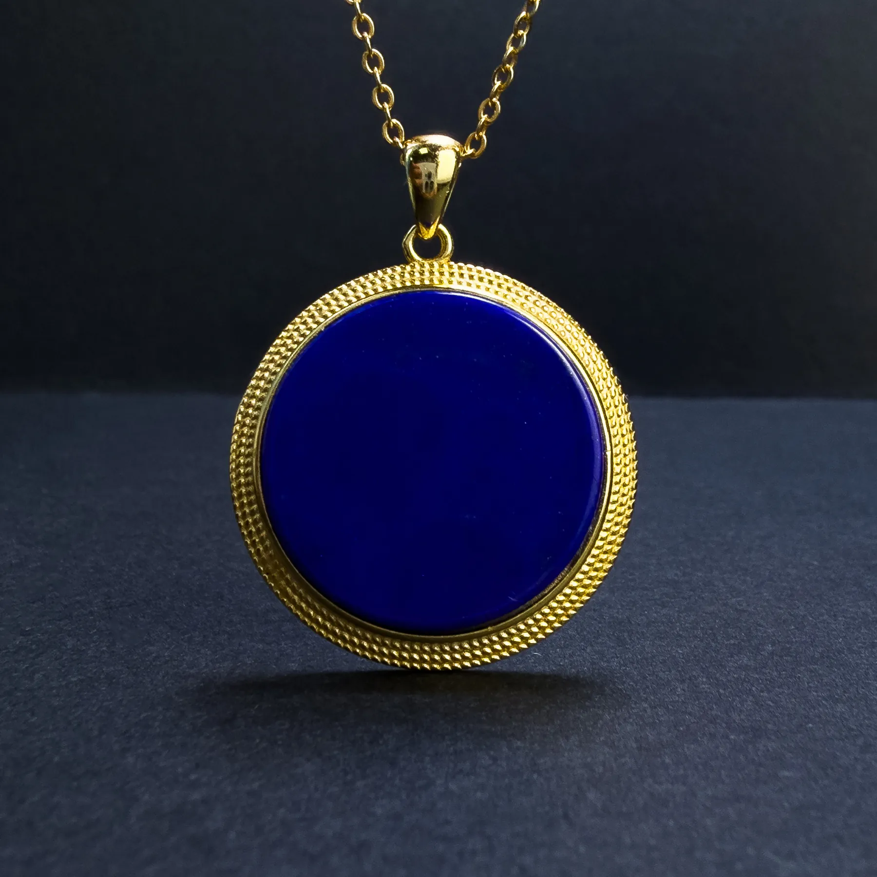 Close-up of a high-quality royal-blue lapis lazuli pendant with very little visible calcite