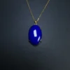 Front view of polished royal-blue oval lapis lazuli pendant