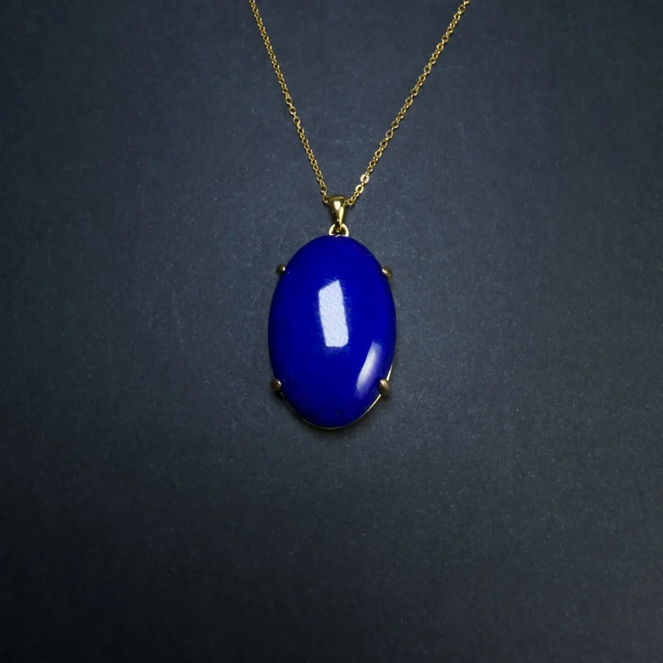 Front view of polished royal-blue oval lapis lazuli pendant