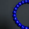 Close view of lapis beads with subtle gold-colored pyrite flecks