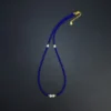 Long flat-lay view of blue lapis lazuli beaded necklace