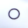 Full lapis lazuli bracelet centered in a wide white composition