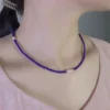 Dainty blue lapis lazuli and pearl necklace worn at the collarbone