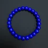 Overhead view of the blue rounded barrel bead bracelet